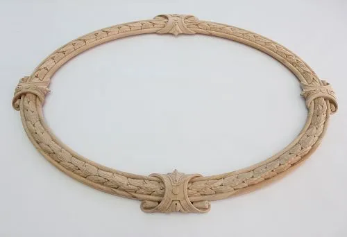 Round wooden frame with carved woven ornament and decorative elements