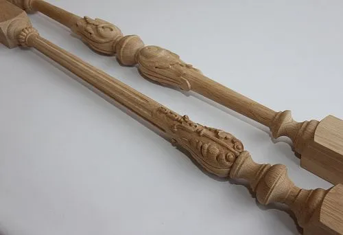 Carved wooden balusters from light solid wood, details of artistic processing