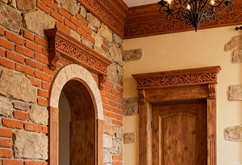 Interior in Russian style with stone and brick masonry, wooden doors and carved cornices