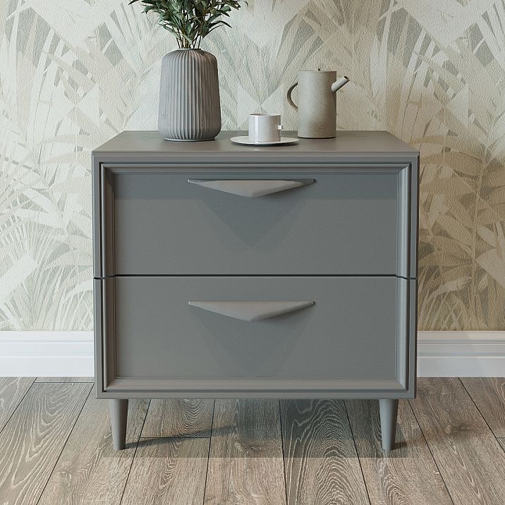 Precision furniture leg MN-145M on a gray chest in a modern interior.