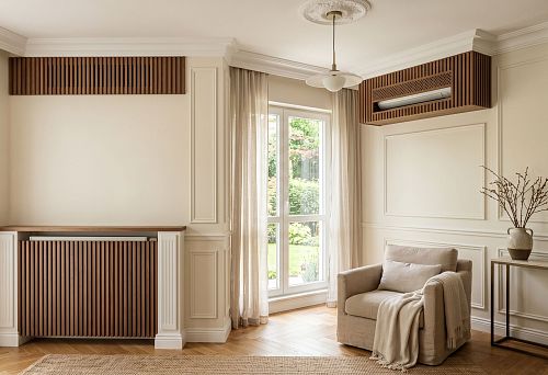 Stucco decor and wooden slats for technical areas: how to beautifully design a radiator, air conditioner, and ventilation