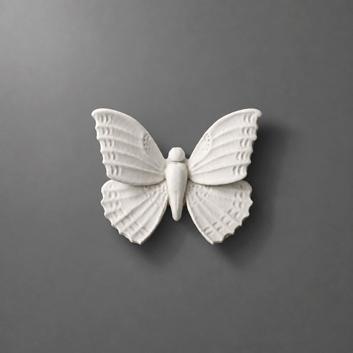 NPU-481 molding in the form of a white butterfly on a gray background.