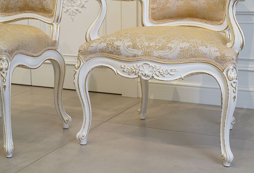 Designer Chair with Noble Fabric Upholstery and Gold Decor