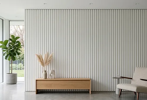 White slatted wall panel in a modern interior with minimalist furniture, wooden cabinet, light armchair, and panoramic glazing