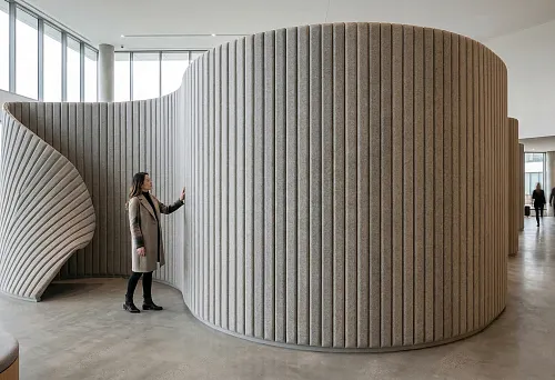 Soft slatted panels in public interiors with a smooth curved shape and pronounced architectural plasticity