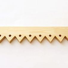 Facade of a wooden house with carved door stops NL-5