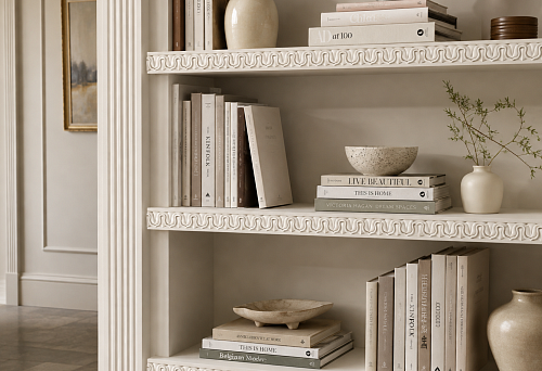 Carved polyurethane molding KPU-004 on the front edges of the open shelving unit's shelves