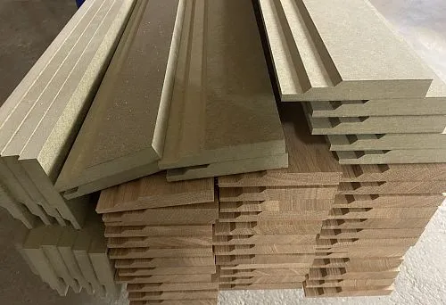Stack of MDF and wooden skirting boards, ready for installation