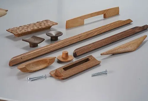 Assortment of modern wooden handles for kitchen furniture in various shapes and sizes