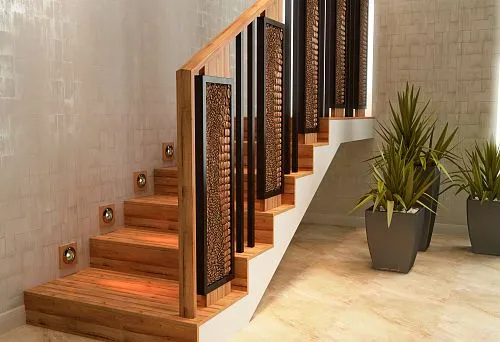 Modern staircase with wooden steps and designer balusters