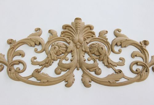 Carved decoration for facades made of natural wood in a classic style on a light background