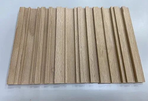 Photograph of wooden planks with vertical relief, highlighting natural wood texture and color.