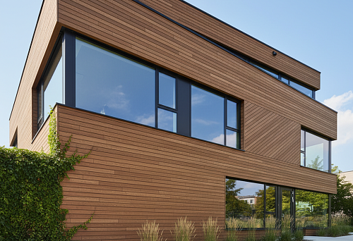 Modern house with a facade finished in wood-look battens