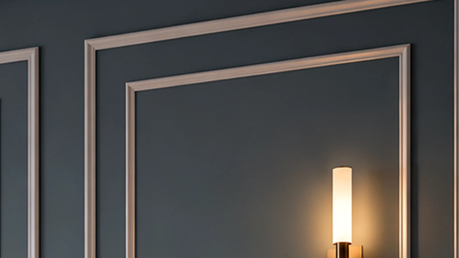 Decorative frame made of moldings on a graphite wall, close-up of the corner joint