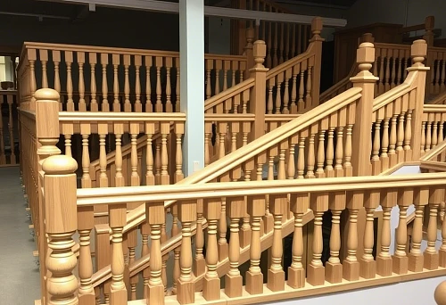 Examples of stair railings with professionally installed wooden balusters