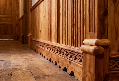 Hallway in Russian style with wooden walls, vertical battens, high baseboard and decorative protective corners