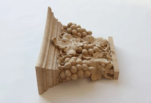 Carved decorative element with grapevine from natural wood
