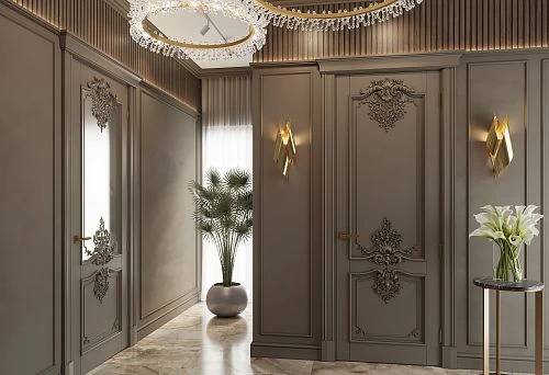 Luxurious hallway with solid wood doors adorned with elegant carved ornaments and golden hardware