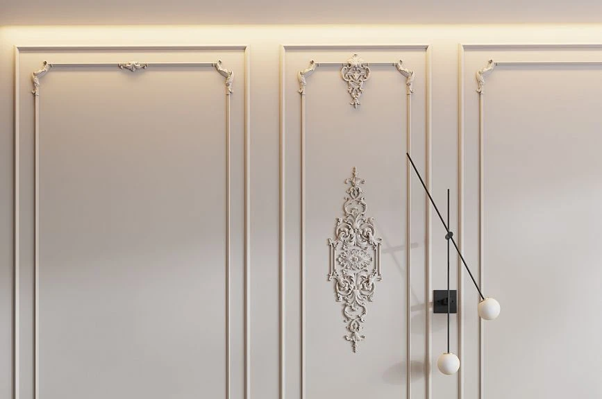 Ornamental Verona overlay on a light wall panel with moldings and designer sconce