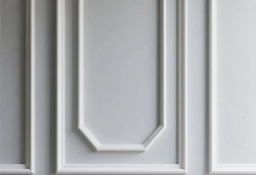 White decorative molding on the wall of a modern interior
