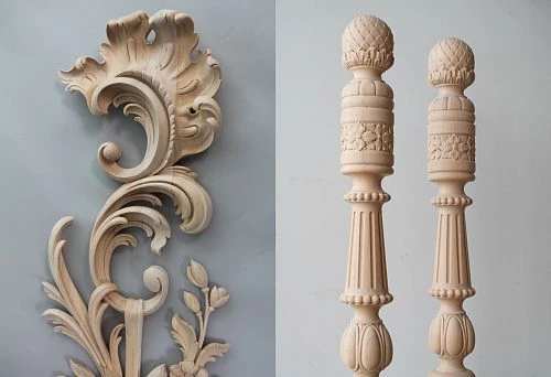 Detailed carved wooden decorative element with smooth leaf-like scrolls and floral motifs