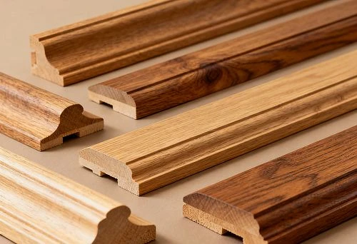 Set of wooden molding products in different shades on a background