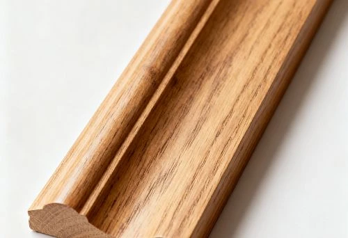 Natural-colored wooden molding profile on a light background