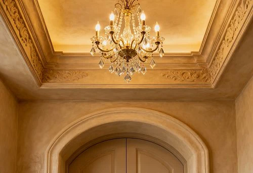 Interior with ceiling medallion and decorative door portal framing in classic style