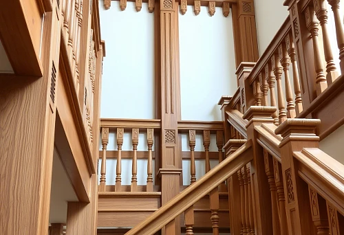 Exclusive wooden balusters and railings on a modern staircase in interior, accent on complex decorative details