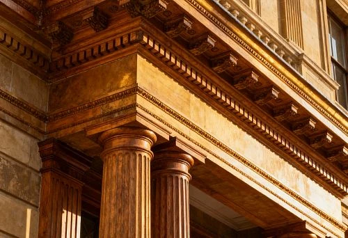 Building facade with classical columns and carved architectural elements