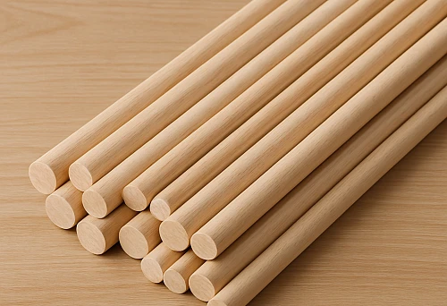 Round wooden molding for walls and ceilings, smooth straight slats made of light wood, neat finishing and clean geometry