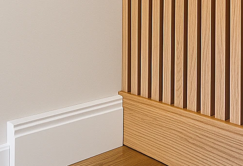 Modern MDF skirting boards and wooden battens in interior design