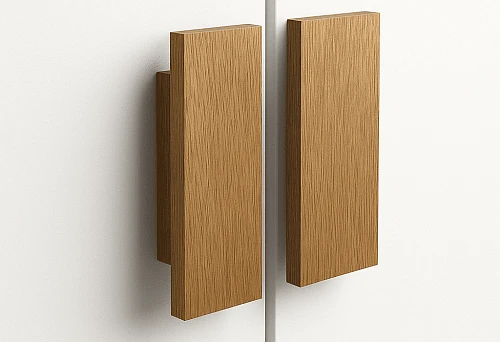 Modern wooden furniture handles in rectangular shape on a white cabinet facade
