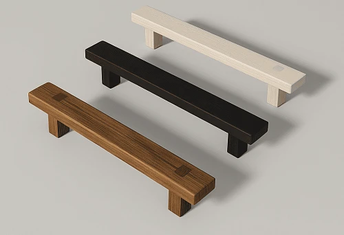 Three wooden furniture handles of different shades (light, black, and dark brown) on a light background.