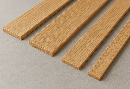 Set of wooden planks of different widths on a light background