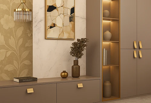 Modern interior with furniture in warm beige tones and gold handles.