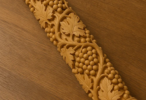 Carved round wooden column with grapevine and leaf pattern