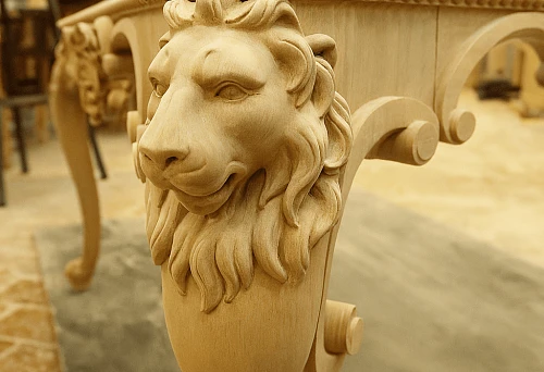 Carved wooden leg in the shape of a lion's head &mdash; a unique design solution for exclusive furniture