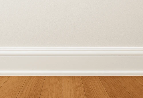White baseboard against a light wall and wooden floor &ndash; an example of harmonious color combination