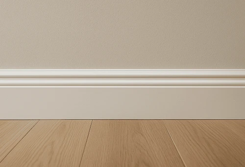 White High Skirting Against a Light Wall and Wooden Floor &ndash; An Example of Classic Interior