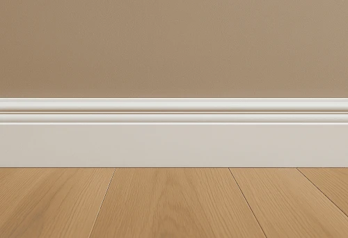 White large baseboard at the junction of wooden floor and wall in interior