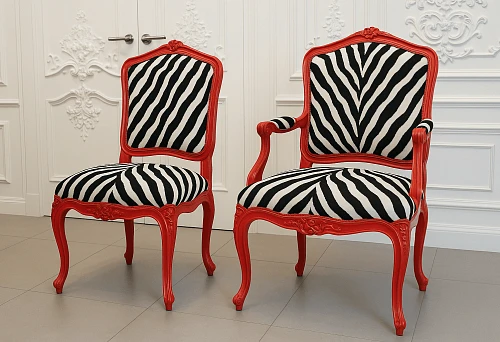 Classic chairs with red frames and zebra upholstery in the interior.