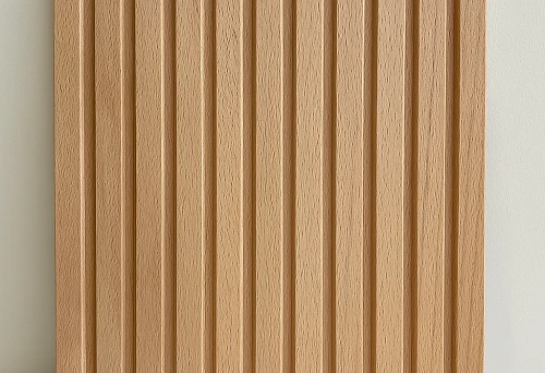 Beautiful light-colored wooden paneling with relief texture