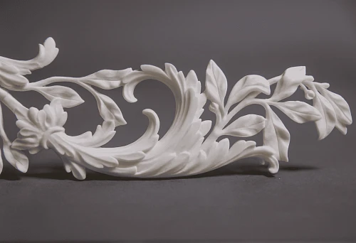 Plastic decorative element with leaves and scrolls