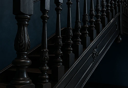 Classic balusters from dark solid wood on the staircase