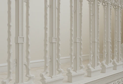 Classic staircase with carved white balusters and decorative handrails