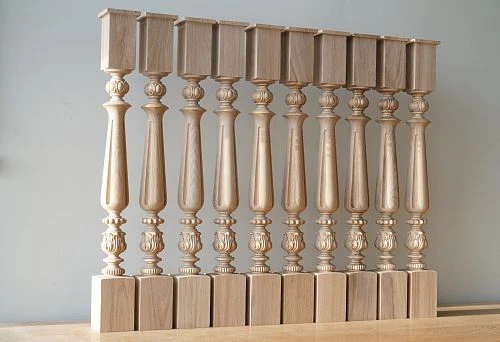 A set of carved wooden balusters neatly arranged in a row, showcasing the skill of wood processing.