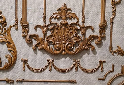 Carved wooden panel with decorative elements, highlighting the beauty and elegance of natural material.