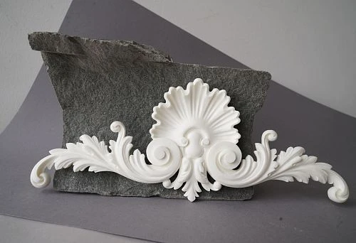 Polyurethane decorative element for modern interior on gray background