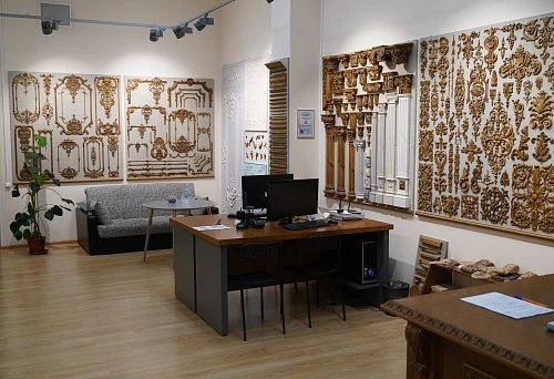 Office Interior with Exhibition of Decorative Wooden Items and Carved Overlays